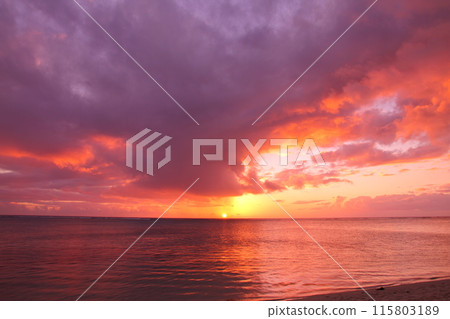 Mauritius, an island nation also known as the Lady of the Indian Ocean. The Indian Ocean sunset from the Brabant Peninsula at the foot of Mount Le Morne, a World Heritage Site. 115803189