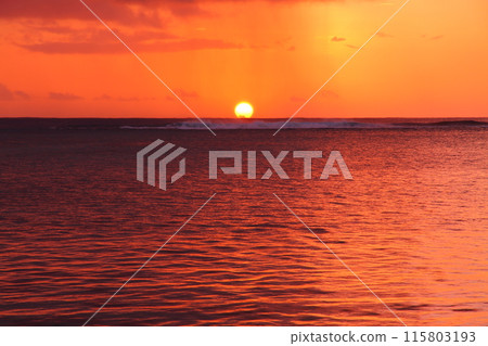 Mauritius, an island nation also known as the Lady of the Indian Ocean. The Indian Ocean sunset from the Brabant Peninsula at the foot of Mount Le Morne, a World Heritage Site. Mauritius, an island nation also known as the Lady of the Indian Ocean. The Indian Ocean sunset from the Brabant Peninsula at the foot of Mount Le Morne, a World Heritage Site. 115803193