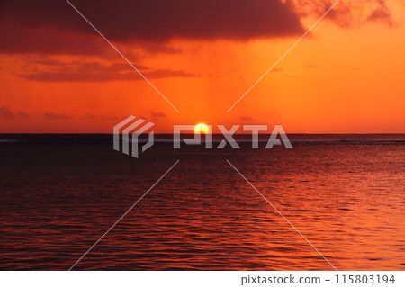 Mauritius, an island nation also known as the Lady of the Indian Ocean. The Indian Ocean sunset from the Brabant Peninsula at the foot of Mount Le Morne, a World Heritage Site. 115803194