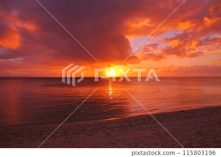 Mauritius, an island nation also known as the Lady of the Indian Ocean. The Indian Ocean sunset from the Brabant Peninsula at the foot of Mount Le Morne, a World Heritage Site. 115803196