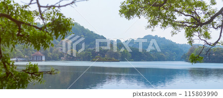 Scenic View of Kandy Lake with Lush Greenery in Sri Lanka Scenic View of Kandy Lake with Lush Greenery in Sri Lanka 115803990