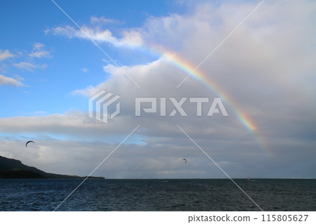 Mauritius, the Lady of the Indian Ocean: A rainbow appears in the lagoon of the Brabant Peninsula, a resort town at the foot of Mount Le Morne, a World Heritage Site 115805627