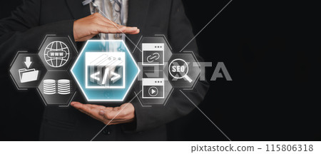 Businessman Holding Digital Icons Representing Web Development, SEO, and Data Management on a Black Background Businessman Holding Digital Icons Representing Web Development, SEO, and Data Management on a Black Background 115806318