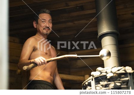 A man in his 50s enjoying the sauna A man in his 50s enjoying the sauna 115807278