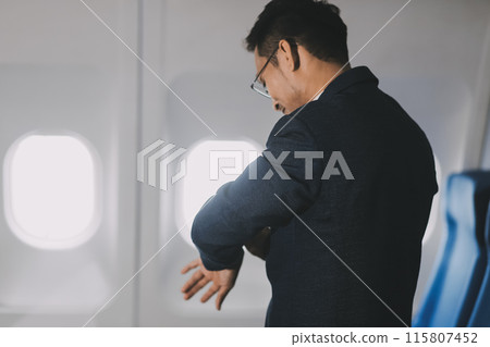 Going To Flight. Arab Businessman Walking With Suitcase In Airport And Looking At Wristwatch, Handsome Middle Eastern Male Traveller Checking Departure Time On Watch, Ready For Air Trip, Copy Space Going To Flight. Arab Businessman Walking With Suitcase In Airport And Looking At Wristwatch, Handsome Middle Eastern Male Traveller Checking Departure Time On Watch, Ready For Air Trip, Copy Space 115807452