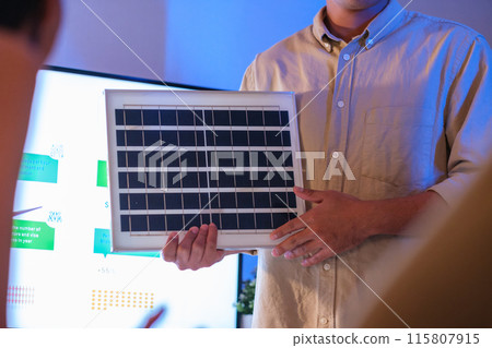 Diversity team presentation new design solar cell panel renewable energy innovation at office 115807915
