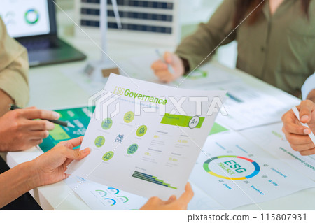 close up diversity team brainstorming focused on ESG (environment,social,governance)  for sdgs goals in a sustainable green office 115807931