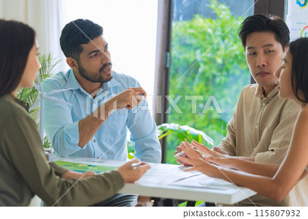 diversity team brainstorming discussion focused on ESG (environment,social,governance)  for sdgs goals in a sustainable green office 115807932
