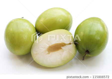 Green jujube fruits on white background. Green jujube fruits on white background. 115808572