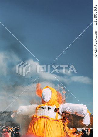 Burning Effigies Straw Maslenitsa In Fire On Traditional National Holiday Dedicated To Approach Of Spring - Slavic Celebration Shrovetide. Belarus. Panorama. Panoramic View 115809632