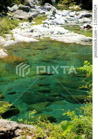 The clear, emerald-green Asemi River 115809824