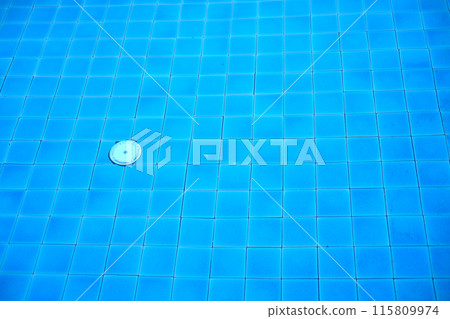 Blue water and ceramic tiles in swimming pool outdoor in garden of resort and hotel 115809974