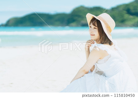 A young woman gazing at the sea in Shirahama 115810450