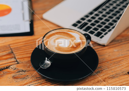 Closeup of coffee cup on table in empty corporate conference room before business meeting in office 115810573