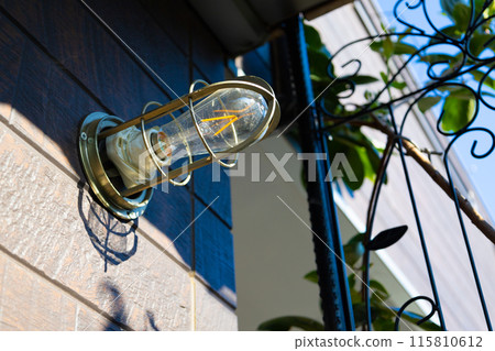 A ship's light bulb (lighting fixture) used as a porch light. Retro ship lighting that looks like a lantern (Tokyo) 115810612
