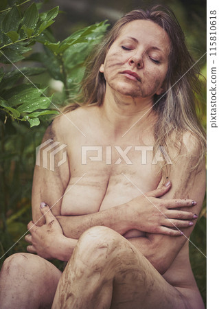 Naked beautiful dirty woman in the evening garden. 115810618
