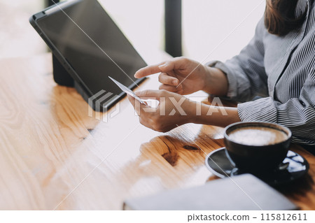 Happy asian woman using smartphone shopping online with credit card. Lifestyle. Easy pay using smart phone or digital device. 115812611