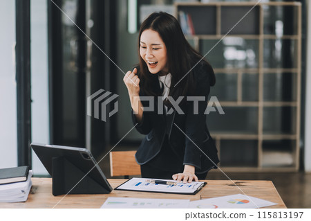 Asian business woman are delighted and happy with the work they do on their tablet, laptop and taking notes at the modern office. Asian business woman are delighted and happy with the work they do on their tablet, laptop and taking notes at the modern office. 115813197