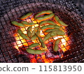 Broad beans roasted on a charcoal grill 115813950
