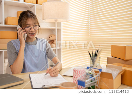 Sell products online, Business owner on the phone talking to a customer, Packaging and Delivery, Packaging and Shipping. 115814413