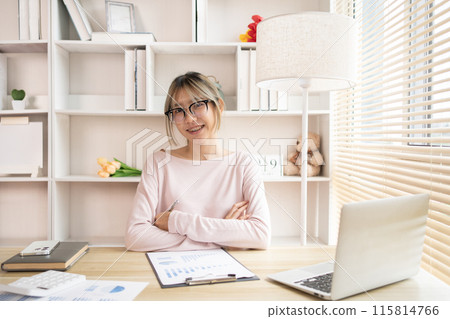 Young woman sitting at computer desk working, Smiling young man ready for work at the start of the week, Work for home. Young woman sitting at computer desk working, Smiling young man ready for work at the start of the week, Work for home. 115814766