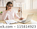 Young woman using a laptop, Work from the comfort of home, Use your laptop for work and communication, Work from home. 115814923