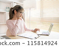 Young woman using a laptop, Work from the comfort of home, Use your laptop for work and communication, Work from home. 115814924