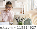 Young woman using a laptop, Work from the comfort of home, Use your laptop for work and communication, Work from home. 115814927