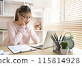 Young woman using a laptop, Work from the comfort of home, Use your laptop for work and communication, Work from home. 115814928