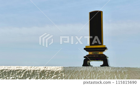 Memorial tablet_Blue sky background left space Memorial tablet_Blue sky background left space 115815690
