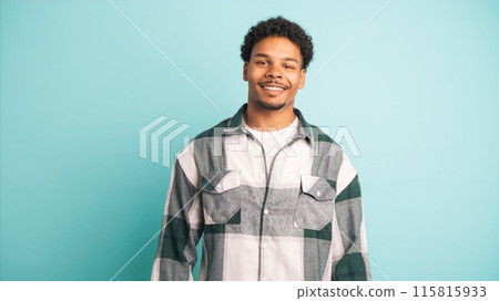 Happy young man in shirt looking at camera Happy young man in shirt looking at camera 115815933