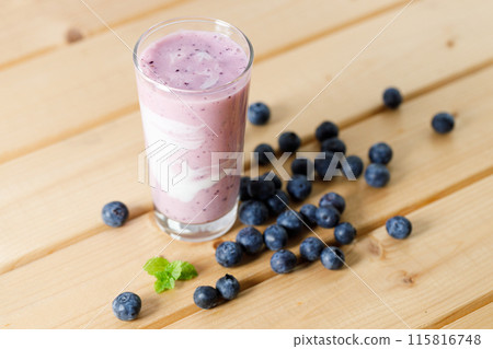 Blueberry smoothie with yogurt in a glass. 115816748