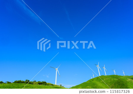 A view of wind power plants towering over the vast outdoors against the backdrop of a blue sky (Aso Nishihara Wind Farm) A view of wind power plants towering over the vast outdoors against the backdrop of a blue sky (Aso Nishihara Wind Farm) 115817326