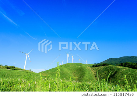 A view of wind power plants towering over the vast outdoors against the backdrop of a blue sky (Aso Nishihara Wind Farm) A view of wind power plants towering over the vast outdoors against the backdrop of a blue sky (Aso Nishihara Wind Farm) 115817456