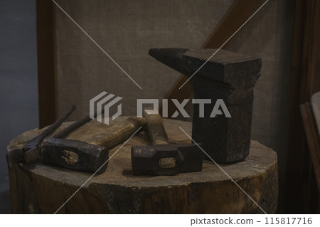 Antique tradition hand tools for metallurgy of the 17th century on a wooden deck. Antique tradition hand tools for metallurgy of the 17th century on a wooden deck. 115817716