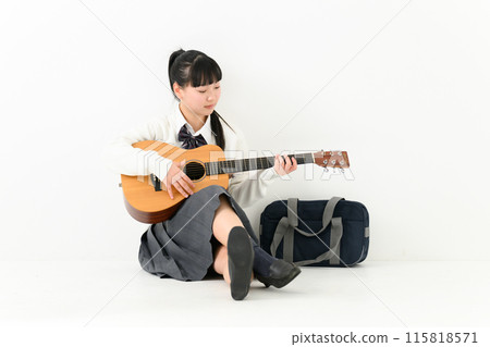 School girls playing the guitar School girls playing the guitar 115818571
