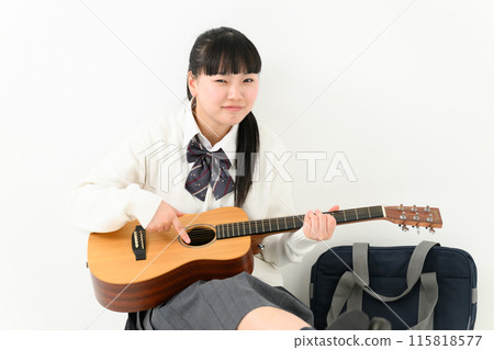 School girls playing the guitar School girls playing the guitar 115818577
