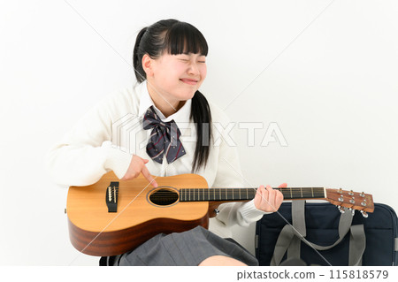 School girls playing the guitar 115818579