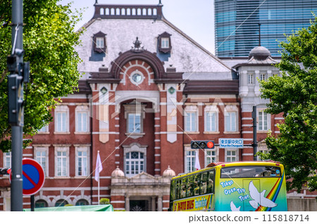 Tokyo cityscape in Japan Inbound tourism revival (bustling Tokyo Station area). Tokyo Station central exit and buses with foreign tourists boarding Tokyo cityscape in Japan Inbound tourism revival (bustling Tokyo Station area). Tokyo Station central exit and buses with foreign tourists boarding 115818714