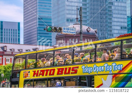 Tokyo cityscape in Japan Inbound tourism revival (bustling Tokyo Station area). Tokyo Station central exit and buses with foreign tourists boarding Tokyo cityscape in Japan Inbound tourism revival (bustling Tokyo Station area). Tokyo Station central exit and buses with foreign tourists boarding 115818722