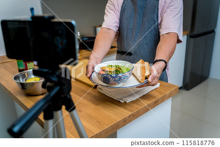 The chef is broadcasting live from workshop how to prepare a vegetarian food The chef is broadcasting live from workshop how to prepare a vegetarian food 115818776