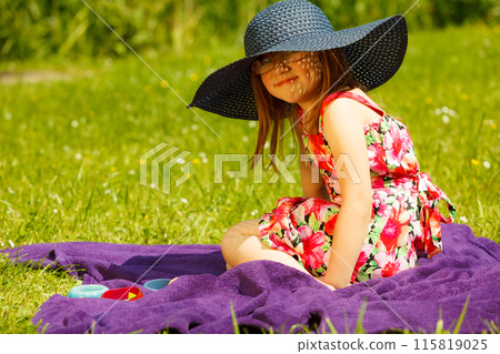 Cute little girl in big hat pretending to be lady Cute little girl in big hat pretending to be lady 115819025