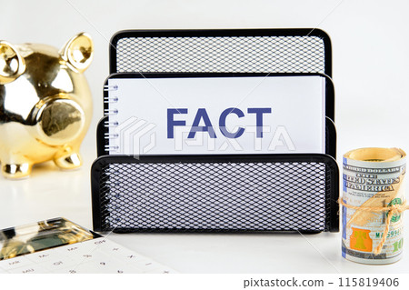FACT CONCEPT. FACT in a notebook on a stand 115819406