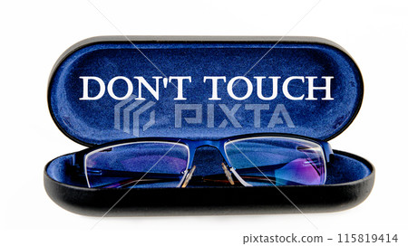 Words DO NOT TOUCH written symbol on the inside of the glasses case on a white background Words DO NOT TOUCH written symbol on the inside of the glasses case on a white background 115819414