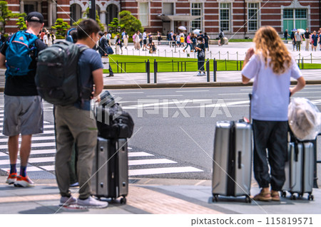 Tokyo cityscape in Japan Inbound tourism is back. Tokyo Station is bustling with foreign tourists. Suitcases… 115819571