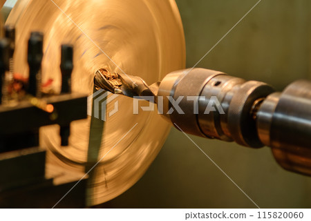 The hole drilling process on brass material parts by lathe machine. The hole drilling process on brass material parts by lathe machine. 115820060