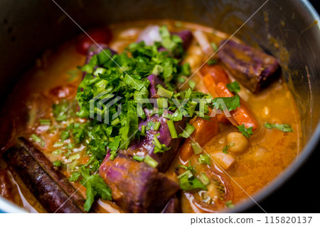 Chef at the kitchen preparing massaman curry with sweet potato and many spices 115820137