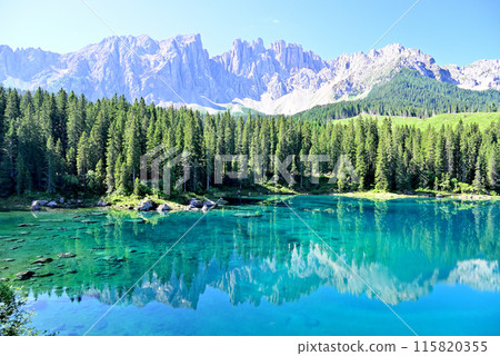 Lake Carezza and the Latemar peaks in the Dolomites Lake Carezza and the Latemar peaks in the Dolomites 115820355