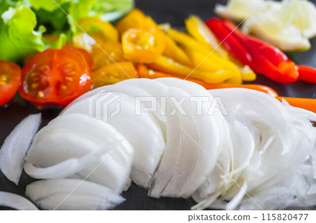 Onion slices and colorful vegetables Onion slices and colorful vegetables 115820477