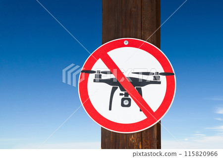 Ban on flying drones. Crossed out flying drone sign. Restrictions on copter flights concept Ban on flying drones. Crossed out flying drone sign. Restrictions on copter flights concept 115820966